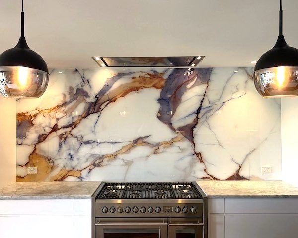 Printed glass kitchen splashback - calcutta gold feature marble
