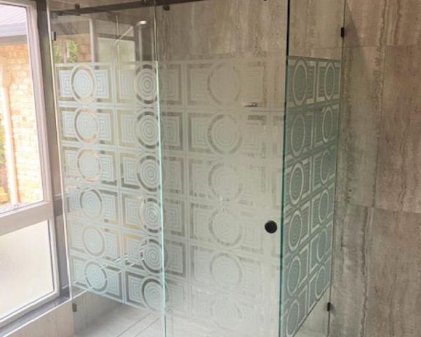 Custom Frameless glass sliding shower screen etched design and black hardware