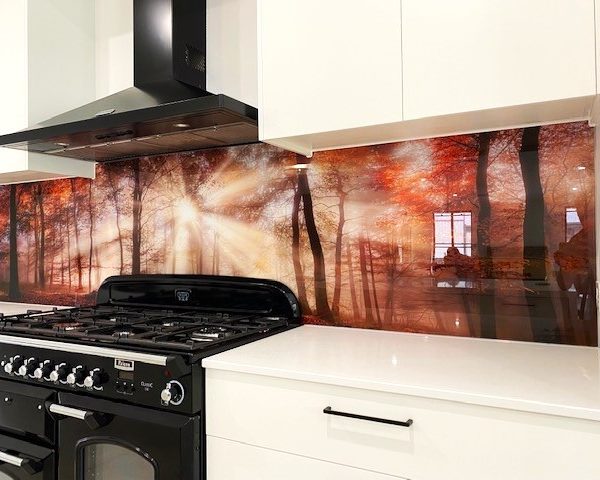 Printed glass kitchen splashback - red and orange sunrise forest